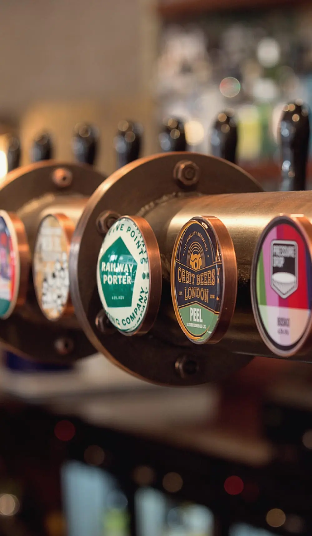 Beer taps on the bar at The Catherine Eddowes