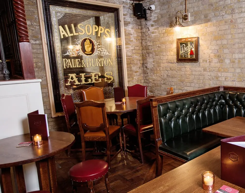 The snug at The Catherine Eddowes, with its vintage Allsopp’s ales mirror and green leather banquette